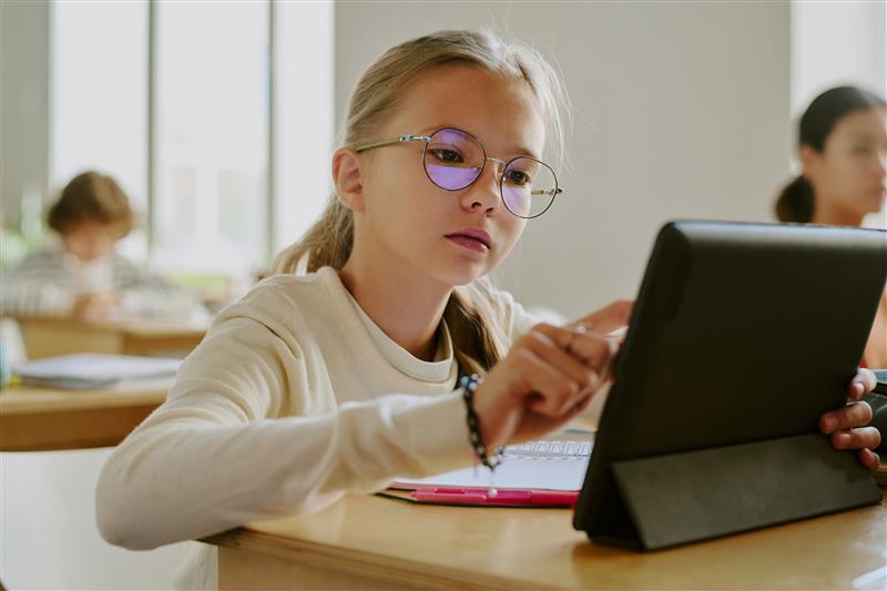 young girl on ipad
